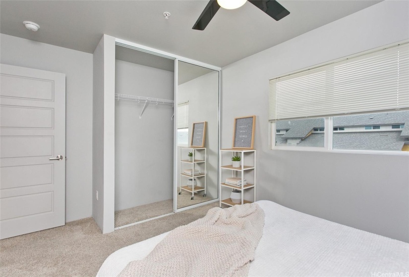 Mirrored closet doors in bedroom