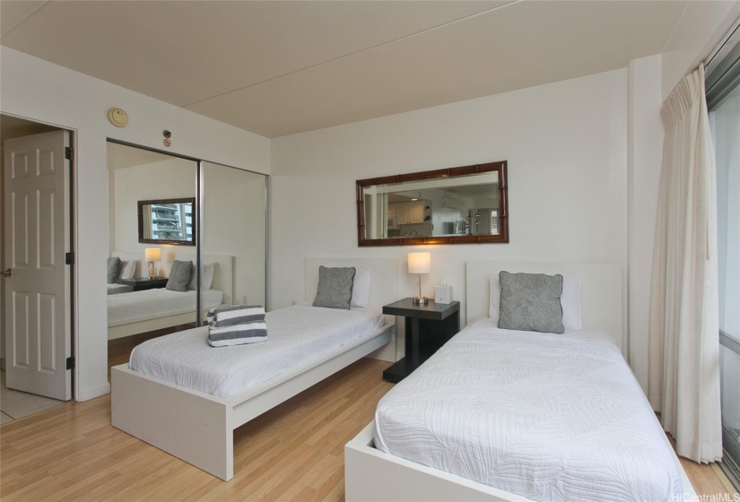 A sliding door divides the living room and bedroom
