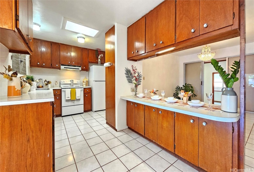 Kitchen with brand new refrigerator and range/oven for added convenience and peace of mind.