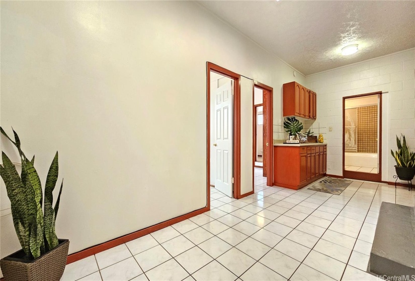 Rear entrance with 2-bedroom, 2-baths and wet bar ~ potential rental property to supplement your mortgage.