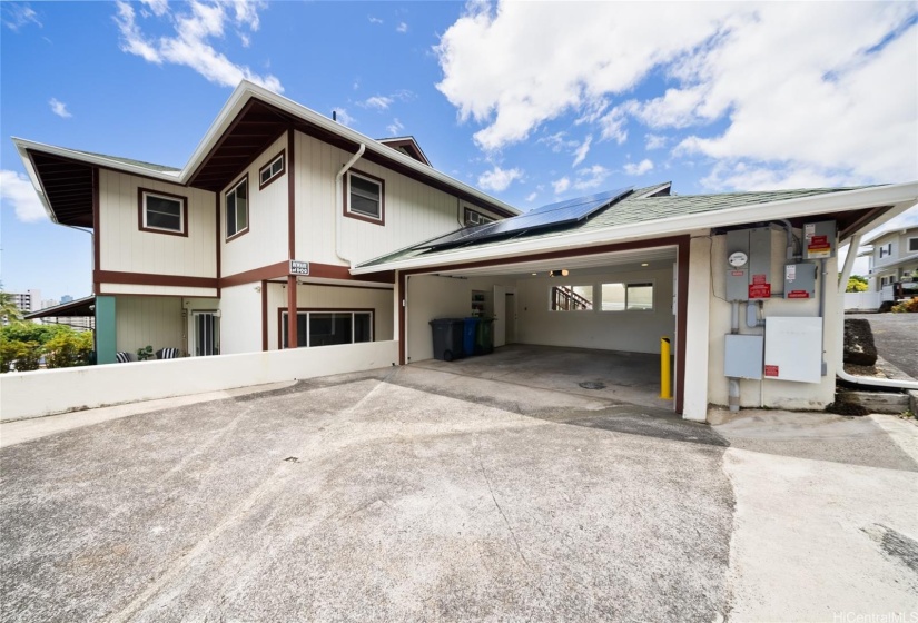 2 car enclosed garage with additional parking in driveway