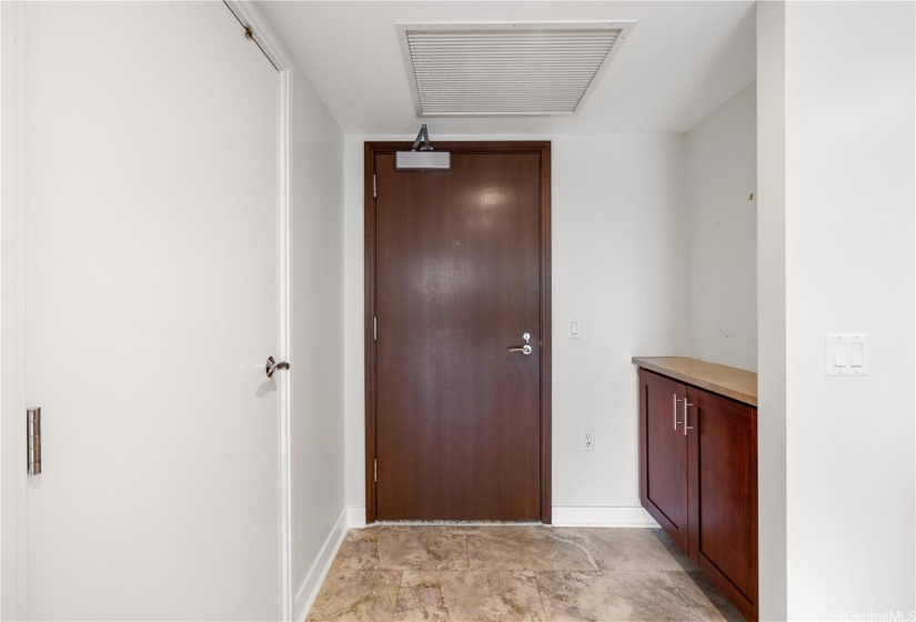 Front entryway with cabinet for shoes and keys