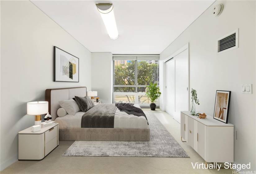 Second bedroom facing east with large windows and a closet organizer system