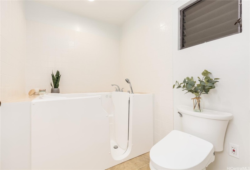 Walk-in soaking tub and Toto bidet