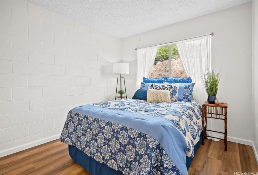 Peaceful Primary Bedroom retreat offers privacy with no neighbor behind this unit.