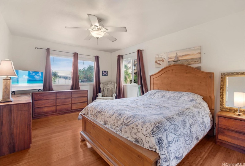 This expansive primary bedroom, located on the ground floor, boasts a generous layout with plenty of natural light.
