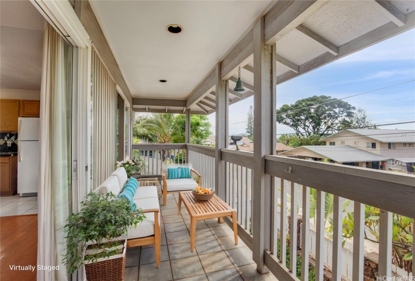 VIRTUALLY STAGED.This spacious upstairs balcony offers an expansive area perfect for relaxation. With ample room for outdoor furniture, it provides a stunning vantage point to enjoy the surrounding views and fresh air.