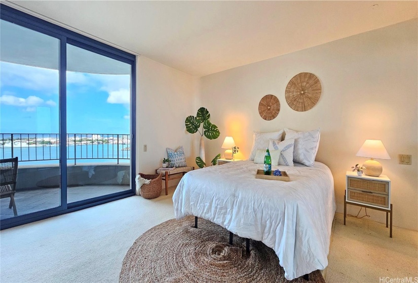 Primary bedroom with lanai access and oceanview