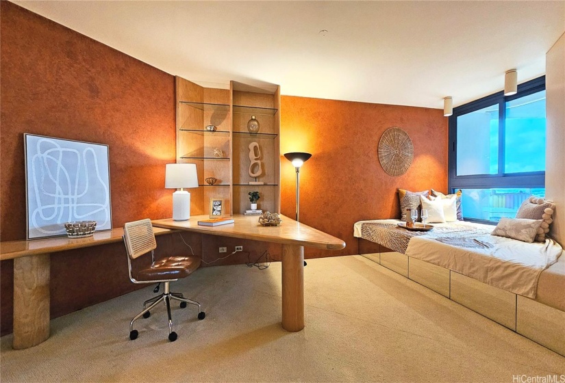 Custom furniture with a multifunctional desk & a sofa that easily converts into a sleeping bed (with storage drawers underneath), ideal for work-life balance or hosting overnight guests.