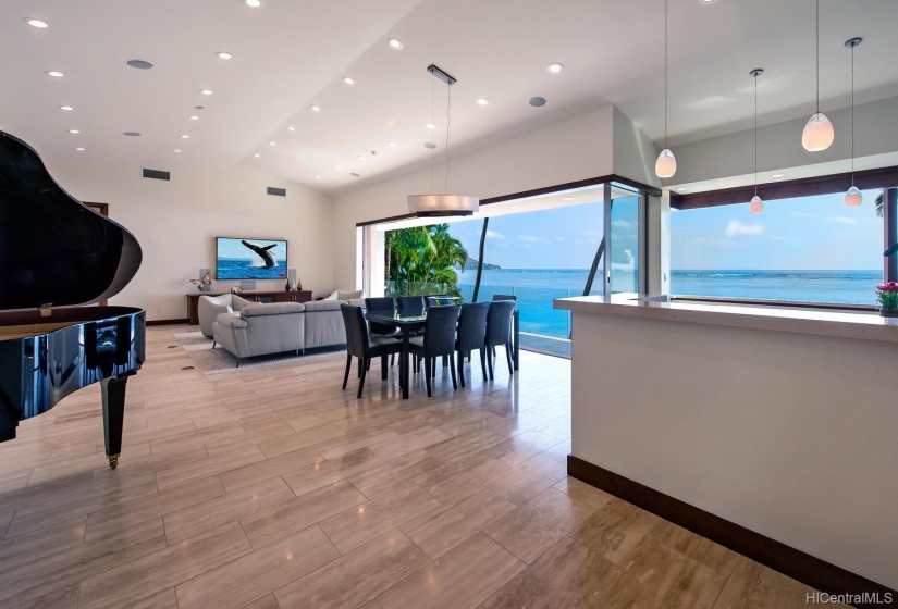 Open floor plan with elegant lighting will impress your guests. Triple pane windows on entire mauka side and foam insulated outer walls & ceiling block out heat and all road noise one might assume you could hear.