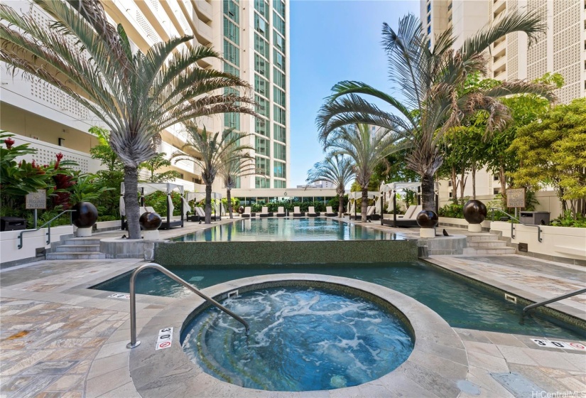 Hot Tub with pool in back ground