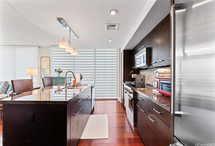 kitchen with center island open to living area.