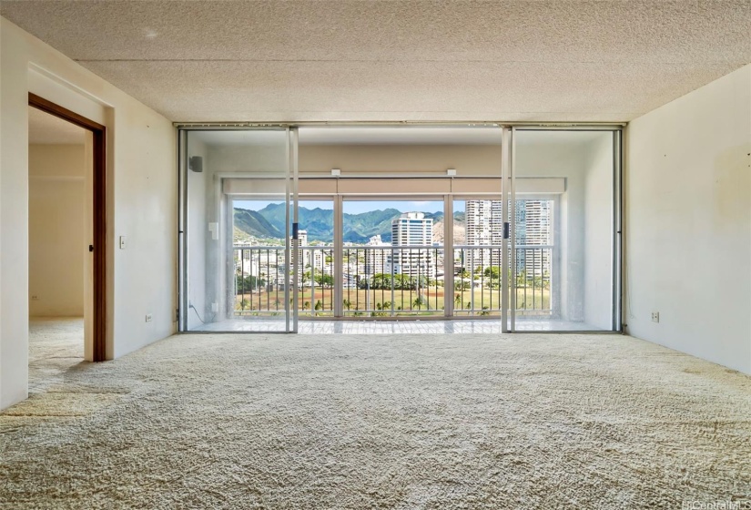 Large sliding glass doors and windows allow cool breezes and natural sunlight to fill home.