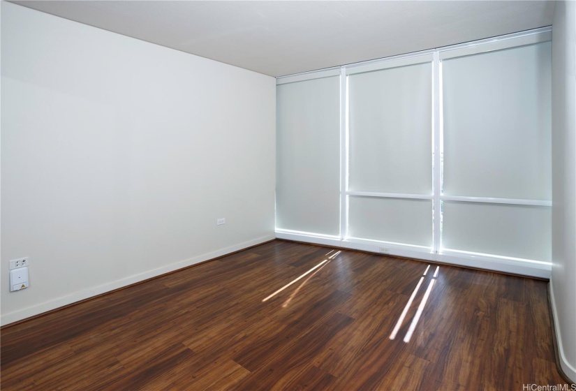 Guest bedroom with motorized blinds