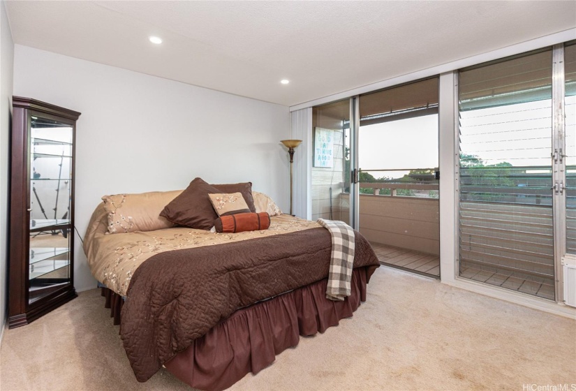 Upstairs primary bedroom with lanai