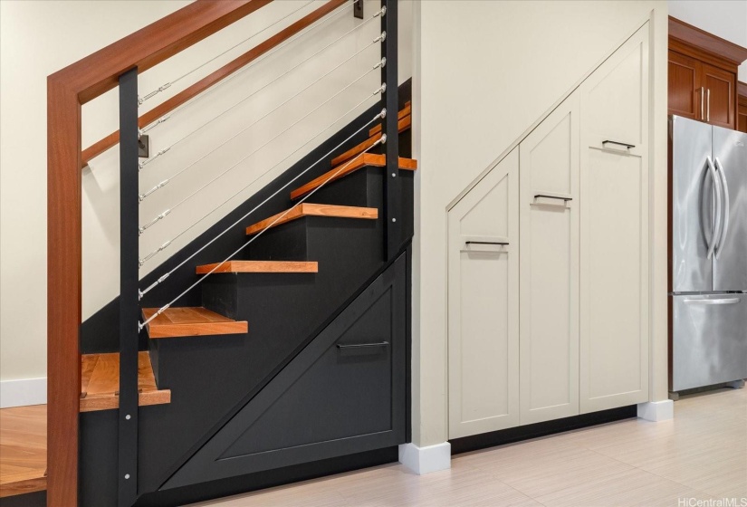 A rare detail includes a superbly designed and custom built staircase, with solid plank steps, pull out pantry and storage drawers!