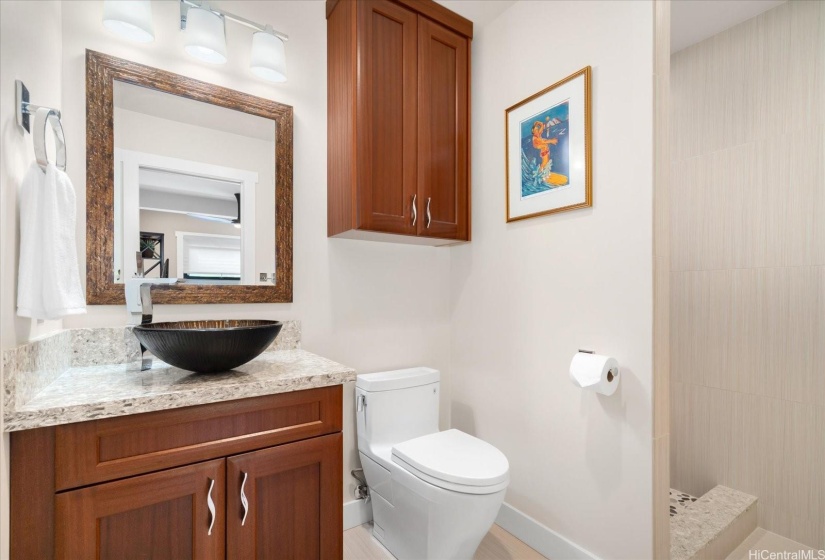 One of 3 FULL bathrooms is on the main level, with a continuation of all quality finishes.