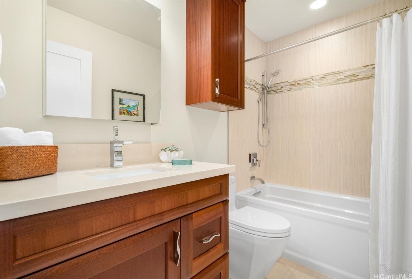 The guest bathroom is beautifully finished and spotless.