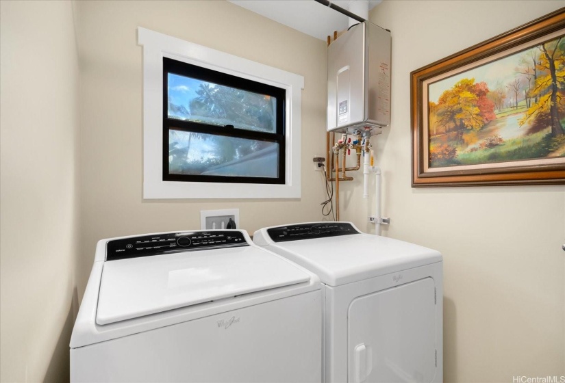 The front expansion of the overall unit provided space for a full laundry room.