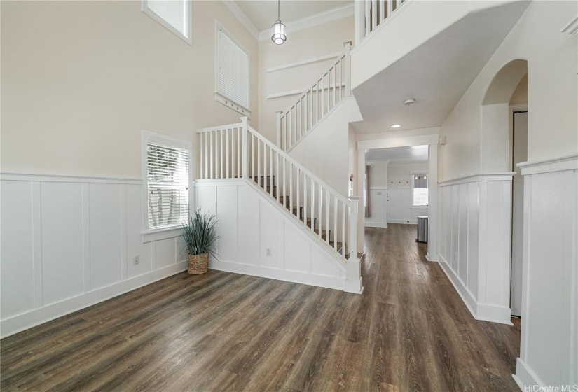 Entryway with tall ceilings and grand staircase