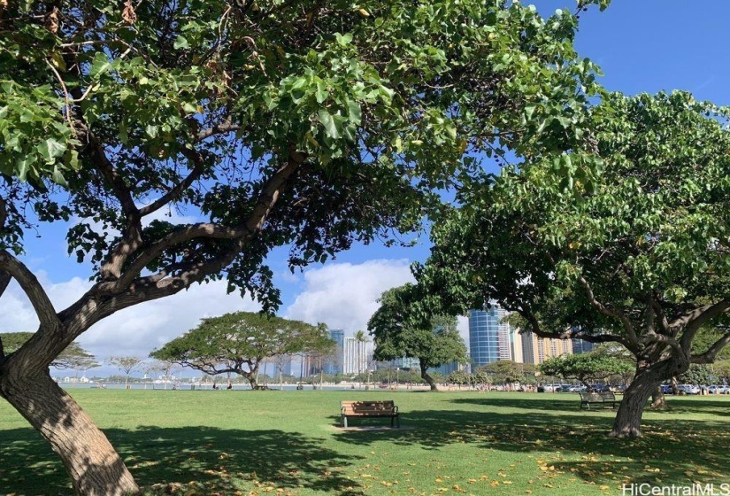 Nearby white sand and green Ala Moana Beach Park