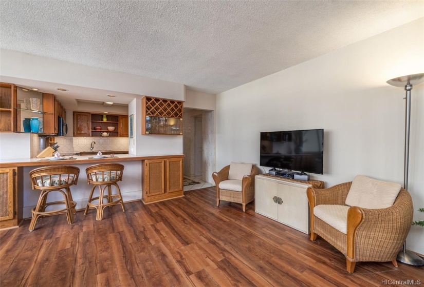 The doorway in the center of the photo leads to the kitchen on the left and the hallway to the bathroom and bedroom on the right.