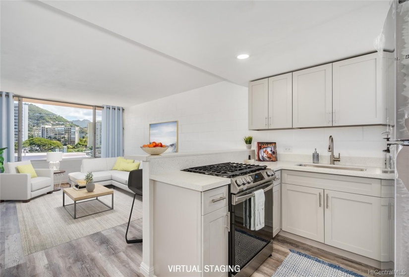 View of beautiful open kitchen with bar seating, looking towards living room