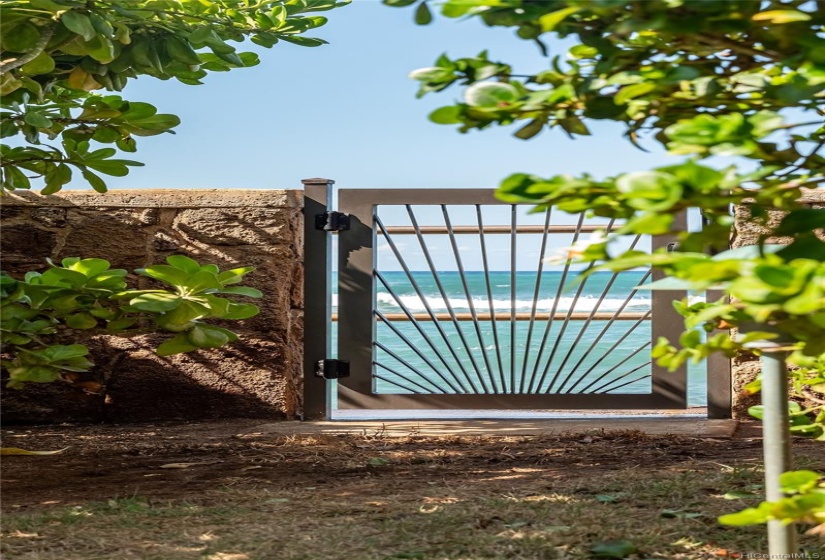 Two locking gates from the backyard lead to the seawall. The south gate is across the footpath from an easy staircase into the ocean.