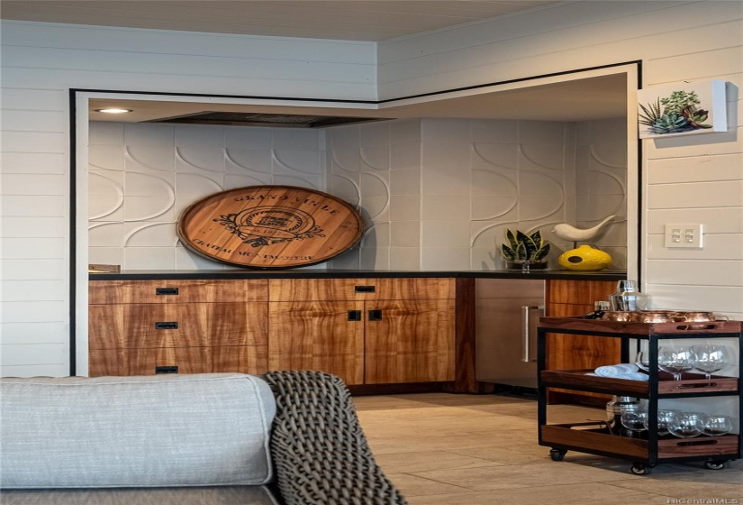 Lanai wet bar has ice maker and wine fridge. Functional cooking vent is visible top left.