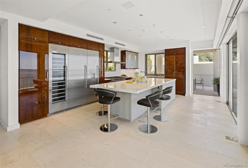 A well designed, beautiful contemporary kitchen features custom cabinetry, top of the line appliances.