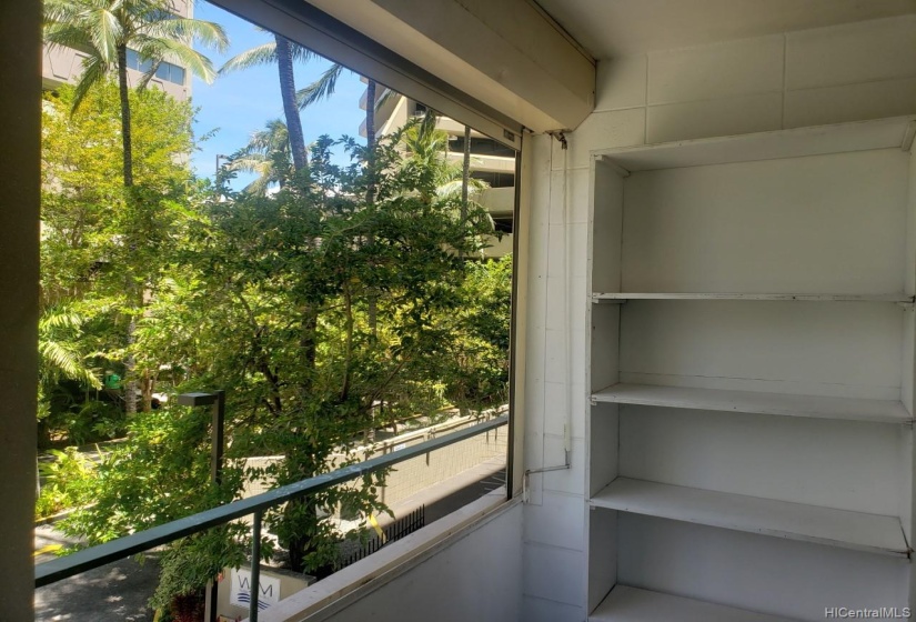 View from other end of the lanai. More shelving for storage.