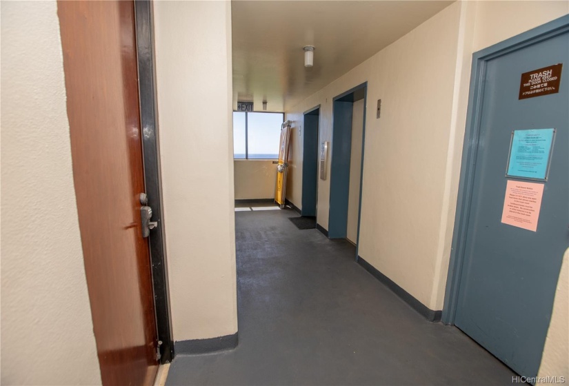 the door on the left is unit 2402, close to the elevator.