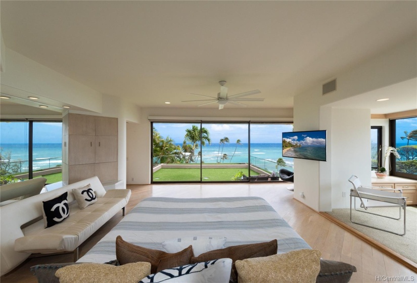 The master suite, which takes up the entire upper level, has a large private lanai and office.