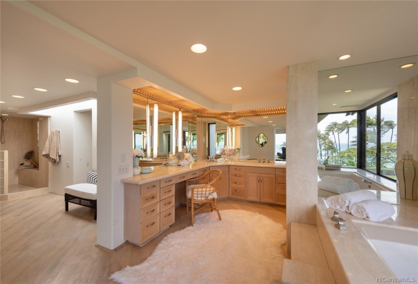 Spacious master bathroom with vanity, shower, and lots of storage.