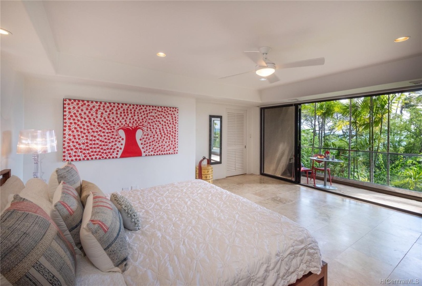 The additional master suite on the lower level has it's own lanai and a private, tropical vibe.