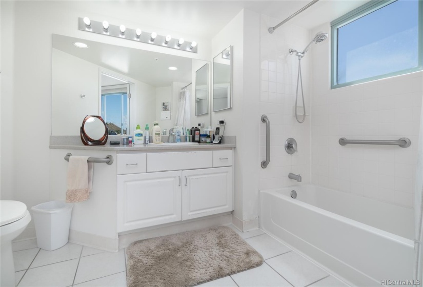 Large vanity in an all white bathroom