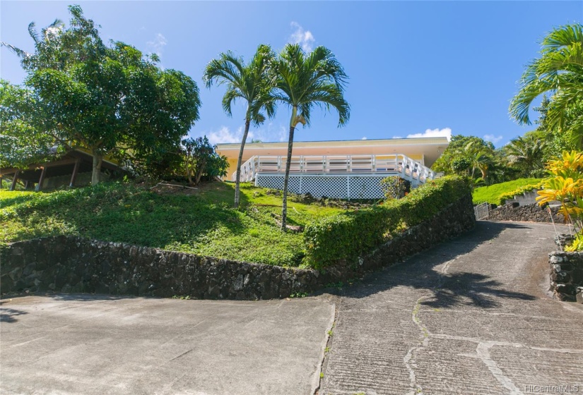 From the lower parking court looking at the house.  House sits high on the property giving it privacy from the street