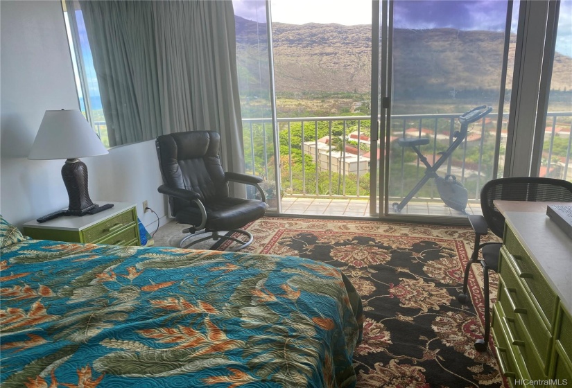 Bedroom with Large Doors Leading to the Lanai