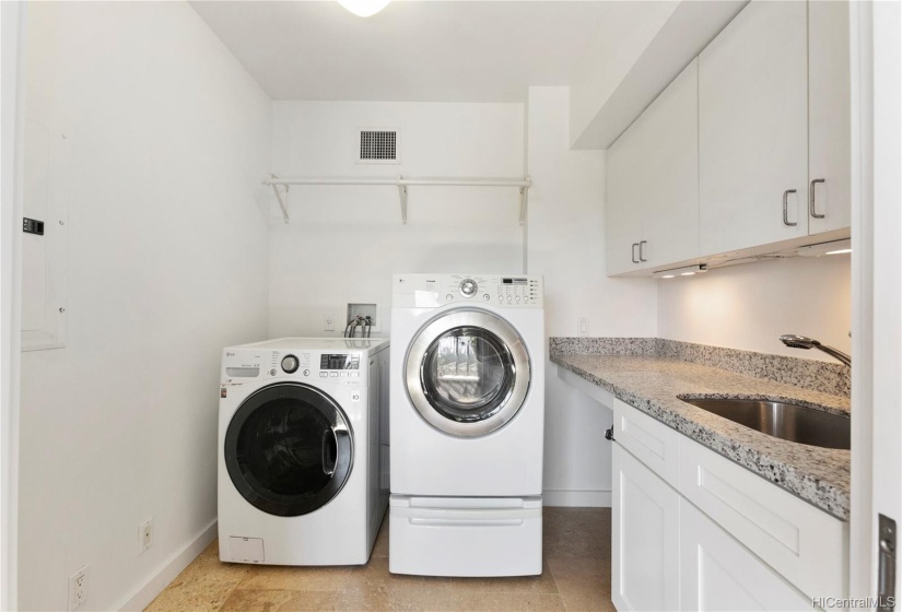 Dedicated laundry room with sink and lots of cabinet & storage space