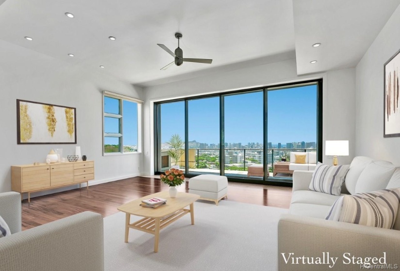 Bright and open living area that has high floor to ceiling sliding doors that provides great indoor-outdoor living! Virtually Staged