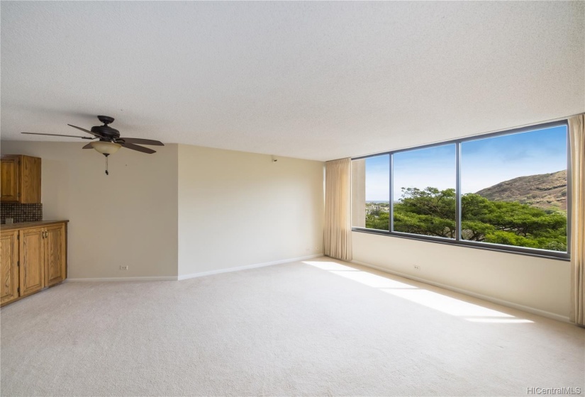 Enjoy mountain and ocean views from the ample living room.