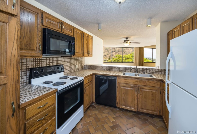 Ample storage space including two pantry cupboards in this well laid out kitchen.